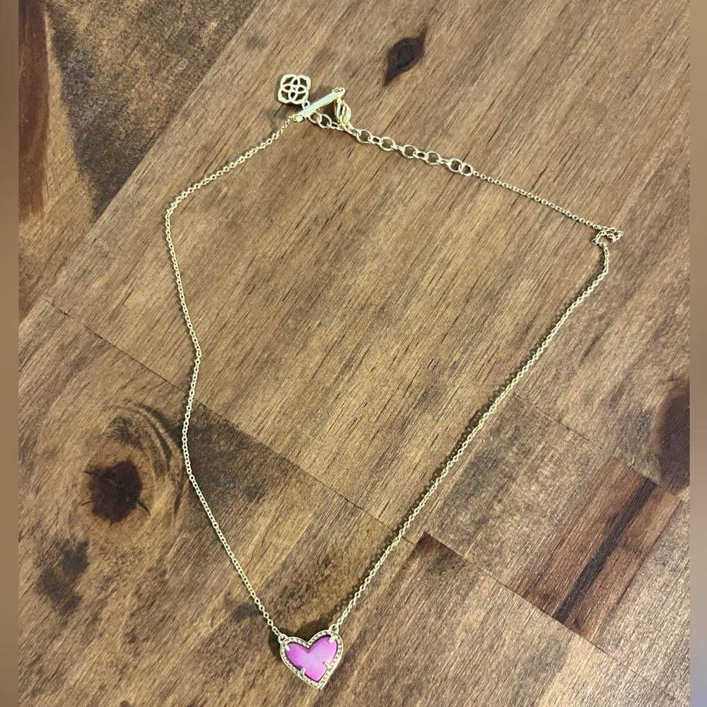 Hot pink Kendra Scott heart necklace.